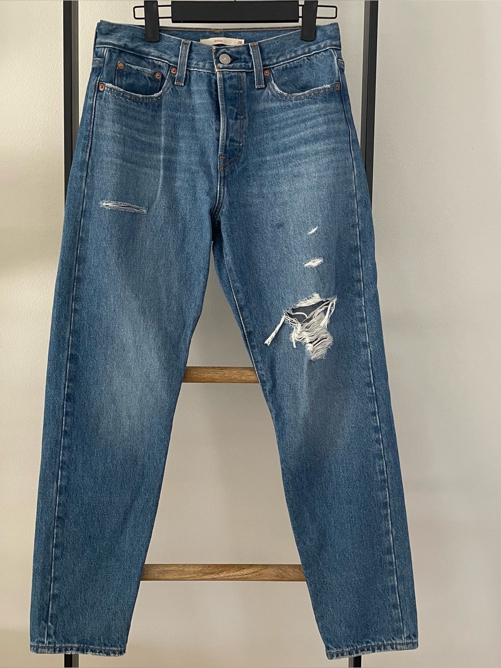 Levi's Wedgie Jeans
Size 26
Blue denim with distressed details
